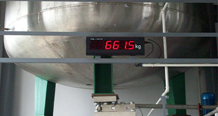 Stainless steel shear beam load cells installed under industrial hopper mixing tanks