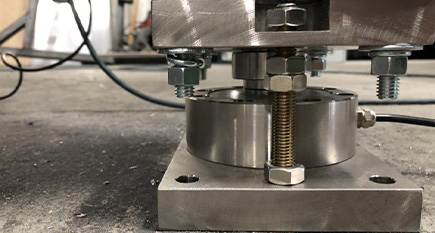 Spoke type compression pancake load cells under heavy industrial cement silos